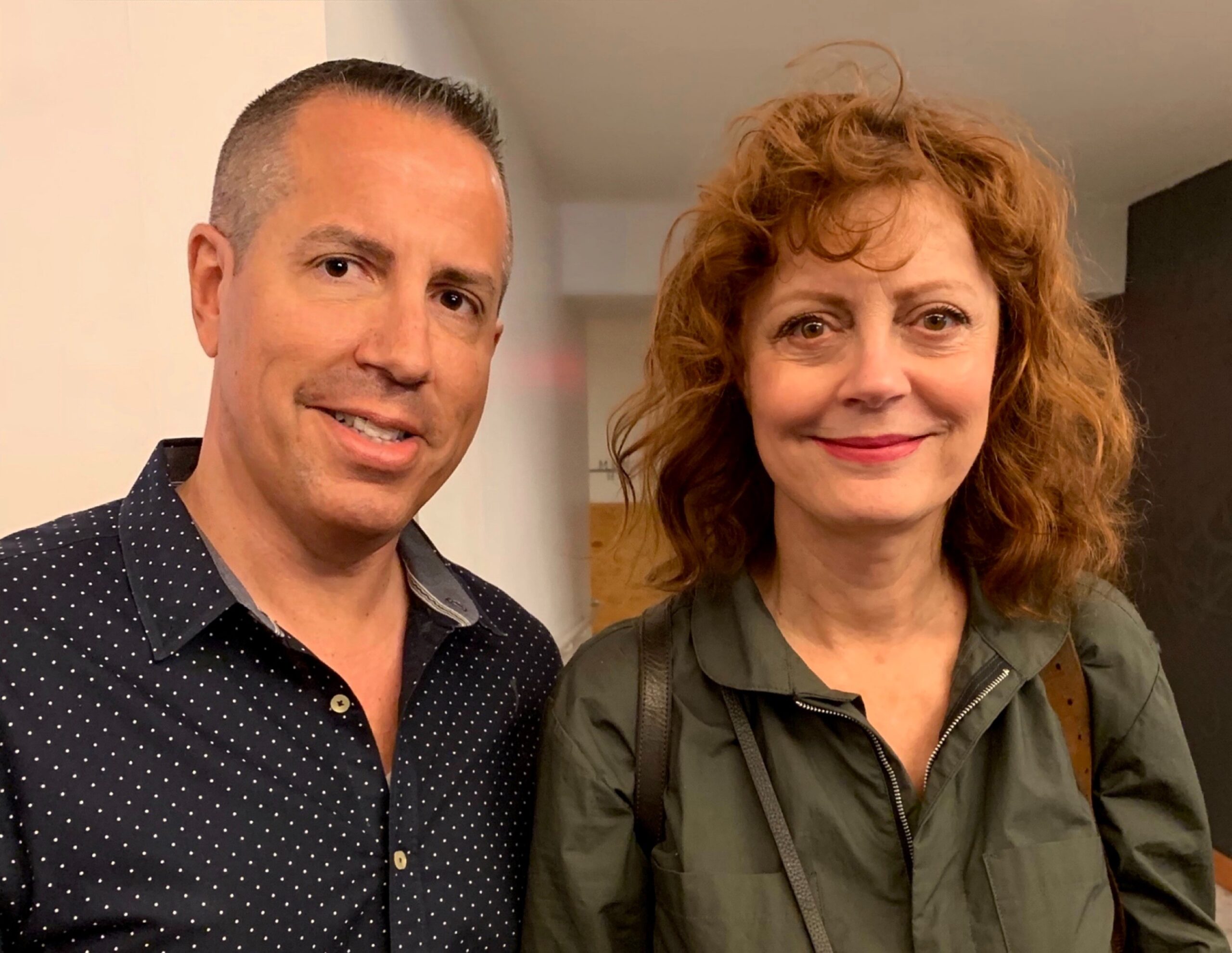 Susan Sarandon posing for an informal photo with Paul Scott Adamo