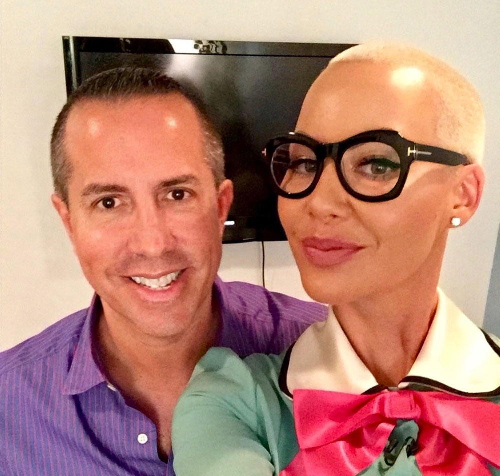 candid shot of Amber Rose with Paul Scott Adamo