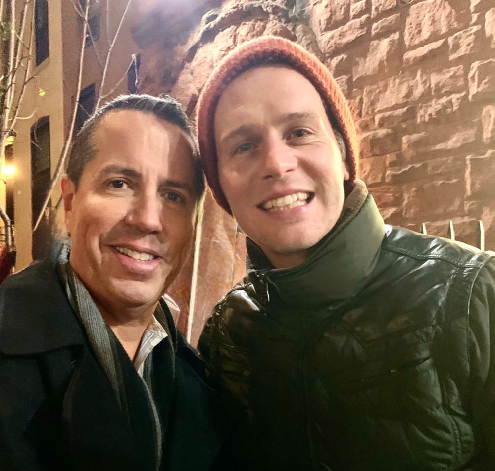 candid shot of Jonathan Groff with Paul Scott Adamo